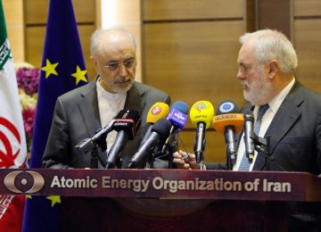 The European Commissioner for Energy and Climate, Miguel Arias Canete (3rd L) meets with  Iran’s nuclear chief Ali Akbar Salehi (3rd R) in Tehran on Saturday.