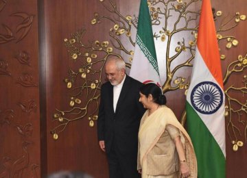 Indian Minister of Foreign Affairs Sushma Swaraj (R) walks next to her Iranian counterpart Mohammad Javed Zarif before a meeting in New Delhi on May 28.