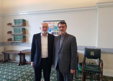 Iran’s Ambassador to London Hamid Baeidinejad (R) meets with the leader of the UK Labour Party Jeremy Corbyn in London on Monday.