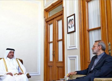 Ali Larijani (R) talks with Qatar’s outgoing ambassador to Tehran, Ali bin Hamad al-Sulaiti. 