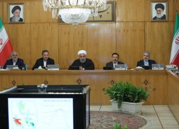 President Hassan Rouhani (C) speaks during a Cabinet meeting on March 7. 