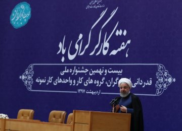 President Hassan Rouhani speaks at a ceremony in Tehran on April 29 to commemorate workers ahead of Labor Day.   