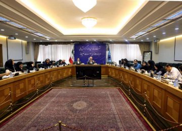 Farshad Heydari (C) addresses a press conference in Tehran. 