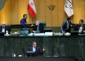 CBI Governor Valiollah Seif (Foreground) addresses the Iranian Parliament on April 10. 