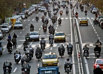 Due to Tehran’s heavy traffic snarls, many prefer to take a motorcycle instead of a taxi.