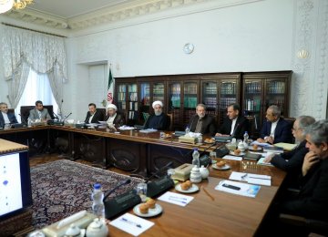 President Hassan Rouhani, flanked by Parliament Speaker Ali Larijani (R) and Judiciary Chief Ayatollah Sadeq Amoli Larijani, attended the meeting in Tehran on June 19. 