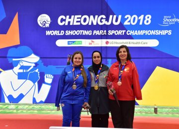 Sareh Javanmardi (C) won gold at the Cheongju 2018 World Shooting  Para Sport Championships.