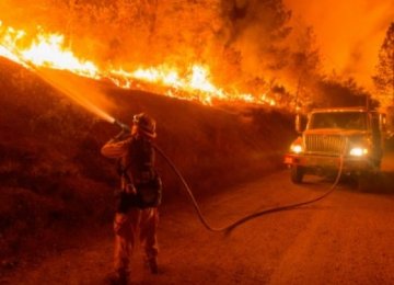 Thousands Flee California Fires