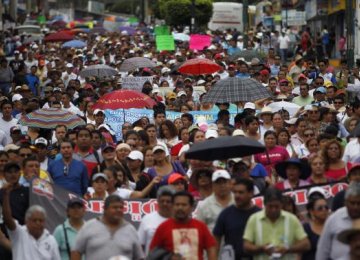 1000s March in Mexico Over Feared Student Massacre