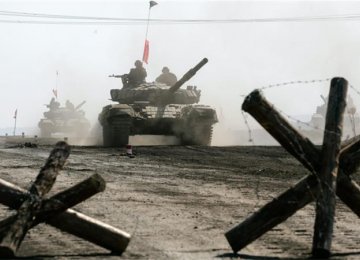 Ukraine’s Warring Sides Begin  Pullback of Weapons
