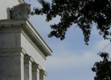 Fed Says Economy Improving