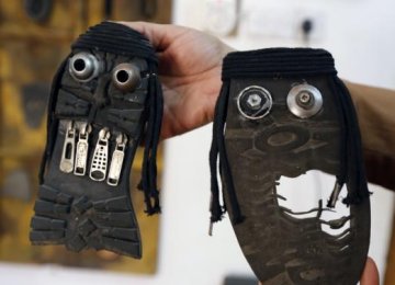 Iraqi Artist Shows ‘Ugly Faces’ of IS With Old Shoes