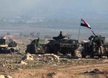 Iraqi forces advance on February 23 towards Mosul airport prior to entering the airport compound for the first time since the IS group overran the region in 2014.