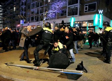 Dutch riot police clash with protesters near the Turkish consulate in Rotterdam on March 11, after a Turkish minister was barred by police from entering the consulate.