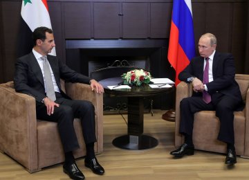 Russia’s President Vladimir Putin (R) meets with his Syrian counterpart Bashar al-Assad in Sochi on November 20.