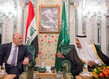 Saudi Arabia’s King Salman (R) talks with Iraqi Prime Minister Haider al-Abadi in Jeddah, Saudi Arabia, on June 19.