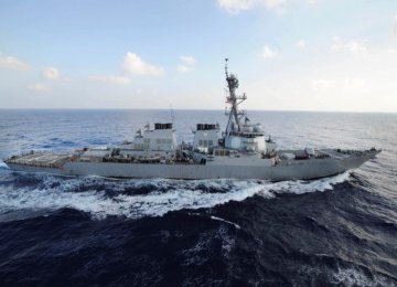 US Vessel Fires Warning Shots at Iranian Boats