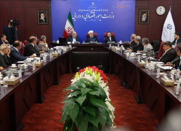President Hassan Rouhani meets top Economy Ministry officials in Tehran on Jan 8.	