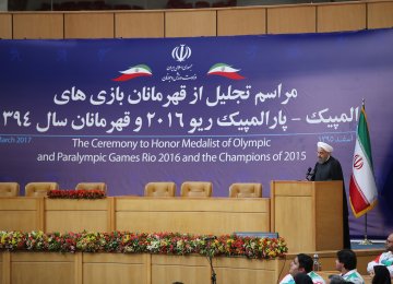 President Hassan Rouhani speaks at a ceremony in Tehran on March 4 to honor medal-winning Iranian athletes in the Rio 2016 Olympics and Paralympics.