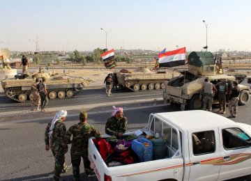 A convoy of Iraqi military trucks makes its way to Kirkuk on October 16.