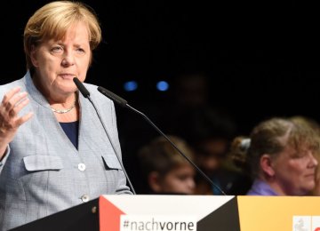 Weakened Merkel Seeking Compromise in Coalition Talks