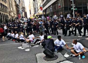 Protestors sit on Fifth Avenue in front of Trump Tower to speak out against the administration’s decision  to end the DACA program on Sept. 5.
