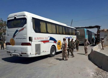 Largest Syrian Rebel Group Starts Leaving Damascus Enclave