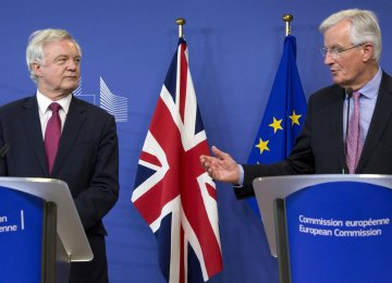 EU Chief Brexit Negotiator Michel Barnier(R), and British Secretary of State David Davis make statements as they arrive at EU headquarters in Brussels on Monday, June 19, 2017