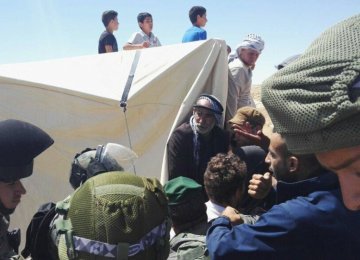 Israeli Forces Raid West Bank Protest Camp