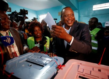 President Uhuru Kenyatta casts his ballot inside  a polling station in his hometown of Gatundu  in Kiambu county, Kenya on August 8.