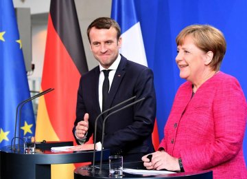 Emmanuel Macron (L) meets Angela Merkel in Berlin, Germany, May 15.