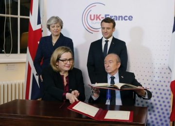 May, Macron Strike Border Security Deal at UK Summit