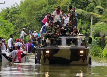 Military forces transfer people to rescue camps in Matara,  Sri Lanka, on May 28.