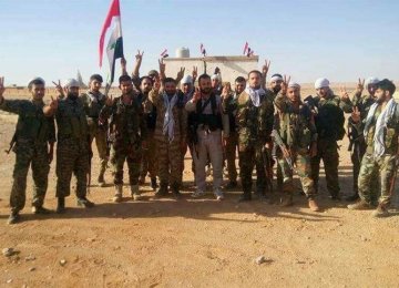 Syrian soldiers celebrating their victory (File Photo)