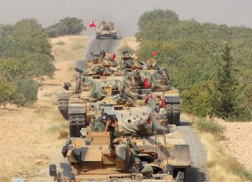 Turkish army tanks make their way towards the Syrian border town of Jarablus, Syria August 24, 2016.