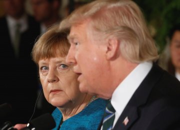 Angela Merkel (L) and Donald Trump