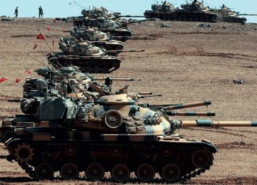 Turkish tanks have taken up position on the Turkish-Iraqi border.