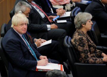 British Prime Minister Theresa May sits in front of British Foreign Secretary Boris Johnson during the 72nd United Nations General Assembly at UN headquarters in New York on September 20