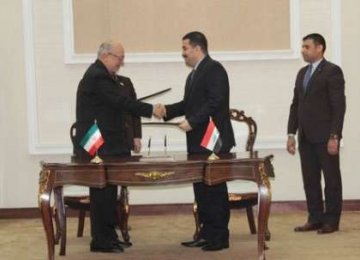 Mohammad Reza Nematzadeh (L) meets Mohammad Shiya al-Sudani in Baghdad on Feb. 14.