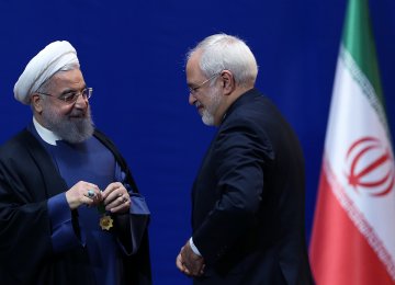 Iranian President Hassan Rouhani (L) awarded the negotiators of the nuclear deal, including Foreign Minister Mohammad Javad Zarif (R) medals of merit in a ceremony in February 2016.