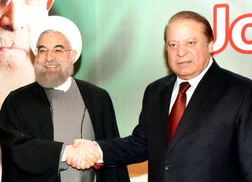 Iranian President Hassan Rouhani (L) shakes hands with Pakistani Prime Minister Nawaz Sharif in Islamabad. (File Photo)