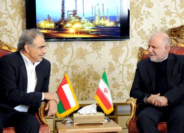 Omani Oil Minister Mohammed bin Hamad al-Rumhi (L) and Bijan Namdar Zanganeh speak in a meeting in Tehran, Feb. 7.