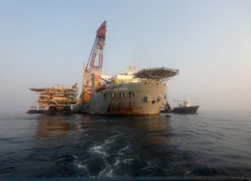[An offshore South Pars platform undergoing installation in the Persian Gulf.
