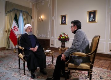 President Hassan Rouhani (L) appeared on state TV late on Jan. 23.   