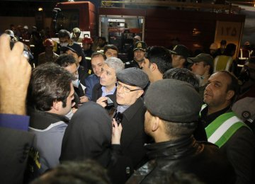 Central Bank of Iran Governor Valiollah Seif visited the site of the tragic building collapse in Tehran on Jan. 21. 