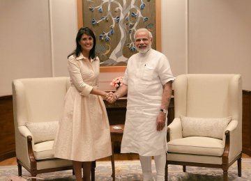 Indian Prime Minister Narendra Modi (R) shakes hands with US Ambassador to the United Nations Nikki Haley  in New Delhi on June 27.