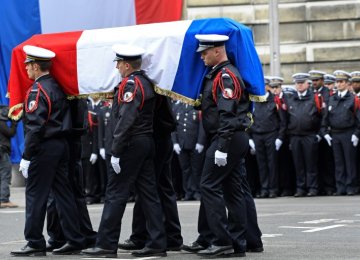 Macron, Le Pen Attend Ceremony for Slain Policeman