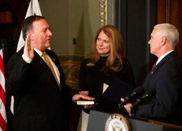 US Vice President Mike Pence (R) swore in Mike Pompeo as CIA director on Monday with Pompeo’s wife, Susan, holding the Bible. 