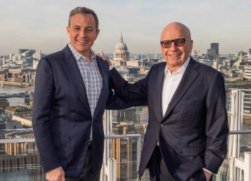 Disney chairman CEO Robert Iger (L) and 21st Century Fox executive chairman Rupert Murdoch