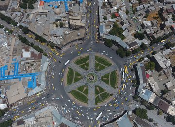 Shop owners at Hamedan's old bazaar need at least a small path to drive their vehicles across Imam Square.